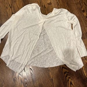 Jolie sheer ivory top with open back slit